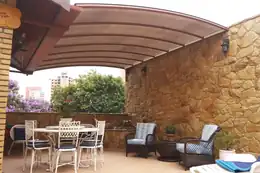 Área gourmet com cobertura curva